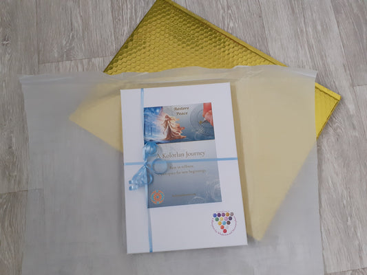 The Restore Peace gift box that begins your journey: A beautiful A4 white gift box with a blue ribbon bow and magical illustration, wrapped in tissue paper and ready to place in the beautiful gold envelope that will transport it to its new owner. Its contents are listed on the webpage.